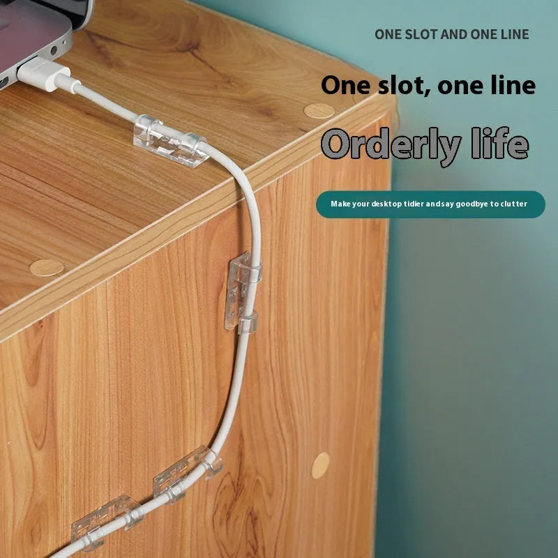 Transparent self-adhesive plastic cable management clips in four sizes on a white background.