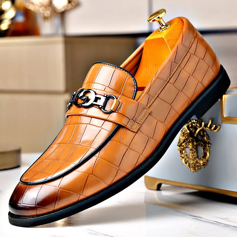 Men's casual leather shoes with embossed horsebit buckle in black, side view showing flat wedge heel and rubber sole