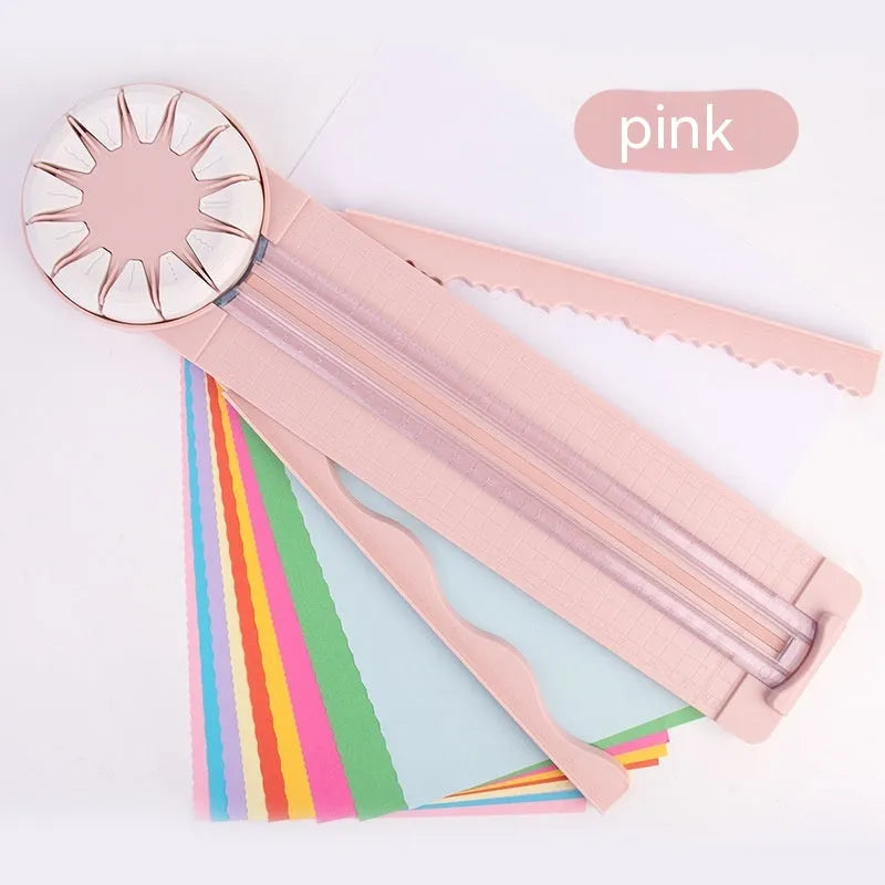 Pink and black 12-in-1 plastic dotted paper cutter on a white background.
