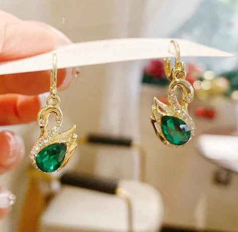 Sweet Rhinestone Swan Earrings in gold, green, and suit colours, showcasing unique design and sparkle.