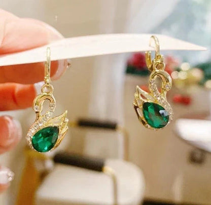Sweet Rhinestone Swan Earrings in gold, green, and suit colours, showcasing unique design and sparkle.
