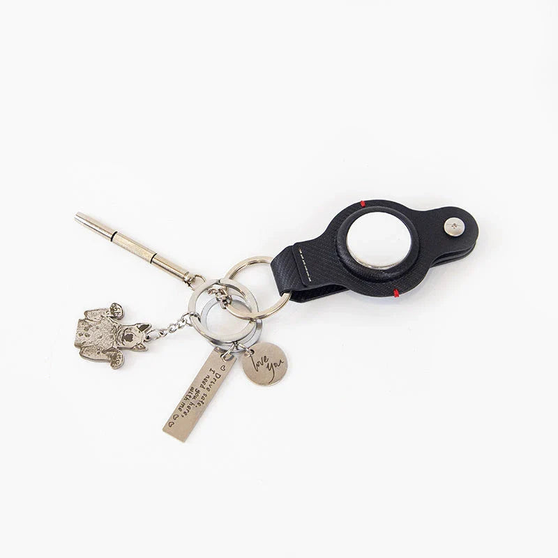 Stylish and durable PU leather AirTag key holder with keychain, available in black and grey colors