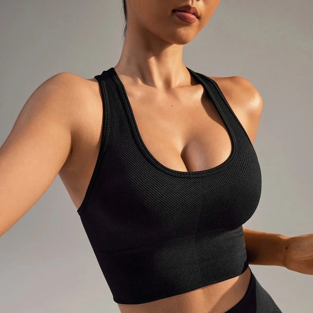 Black women's sports bra with cross back design for running and yoga