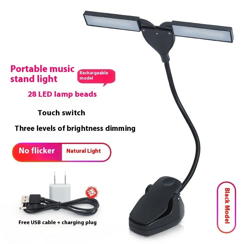 Black plastic music stand lamp with 28 LED lights and a USB charging cable on a music stand.