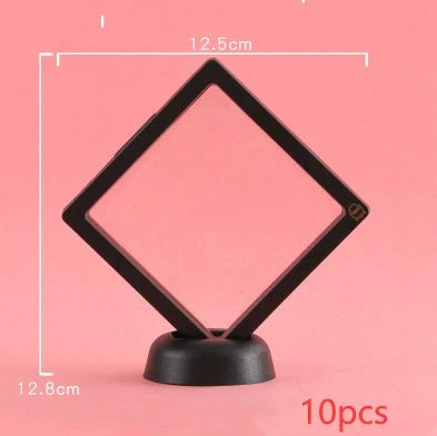 3D floating jewelry display stand showcasing earrings and coins in mid-air