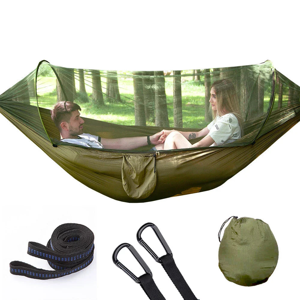Quick-setup hammock with mosquito net for outdoor adventures, featuring durable materials and easy setup.