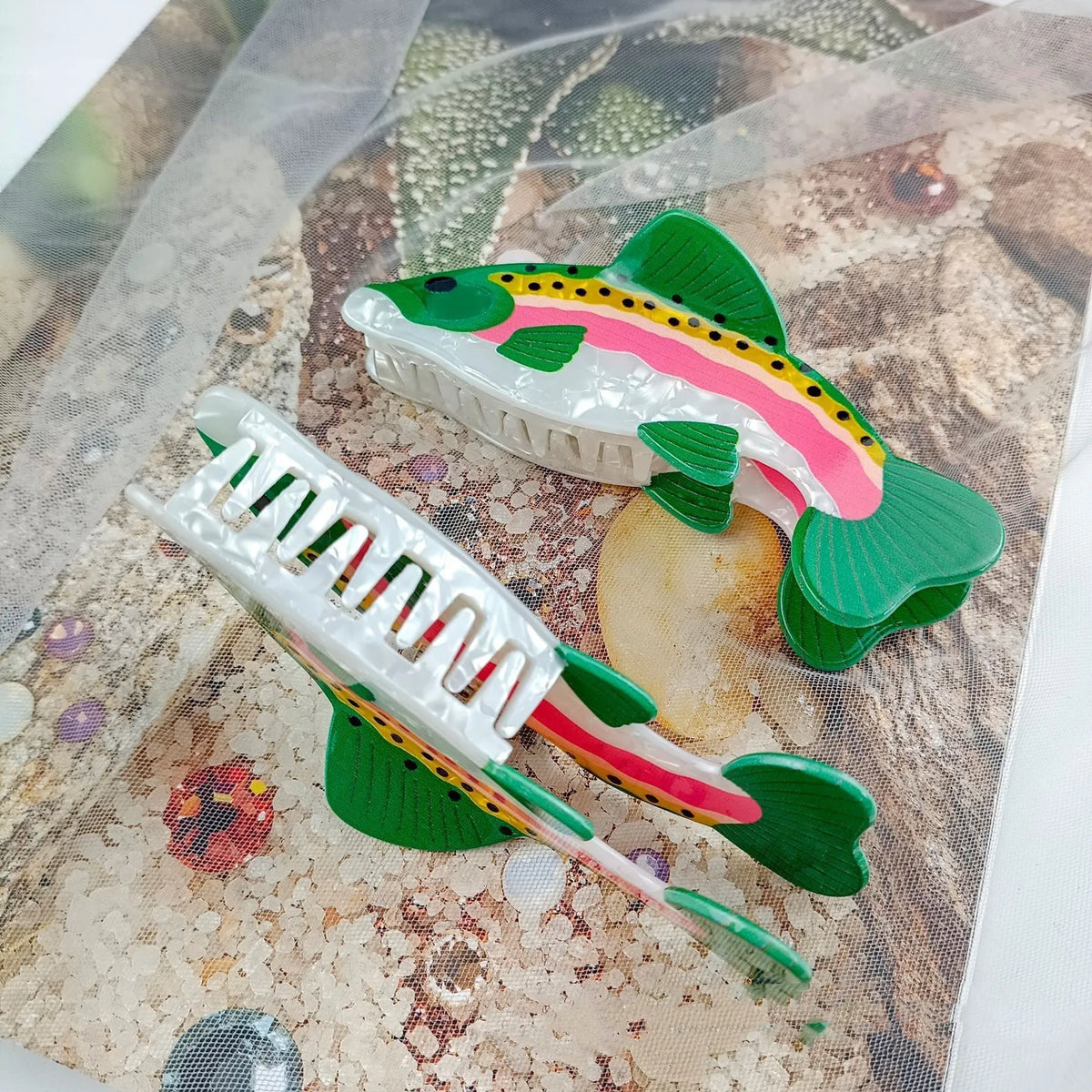 Dark green women's hair clip with detailed printed rainbow trout and carp marine design