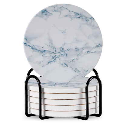 Set of 6 round ceramic coasters with metal stands and cork bases on a wooden table