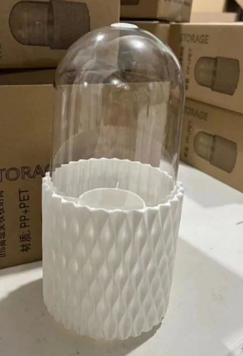 White rotating acrylic makeup brush holder with transparent dust cover showing brush compartments