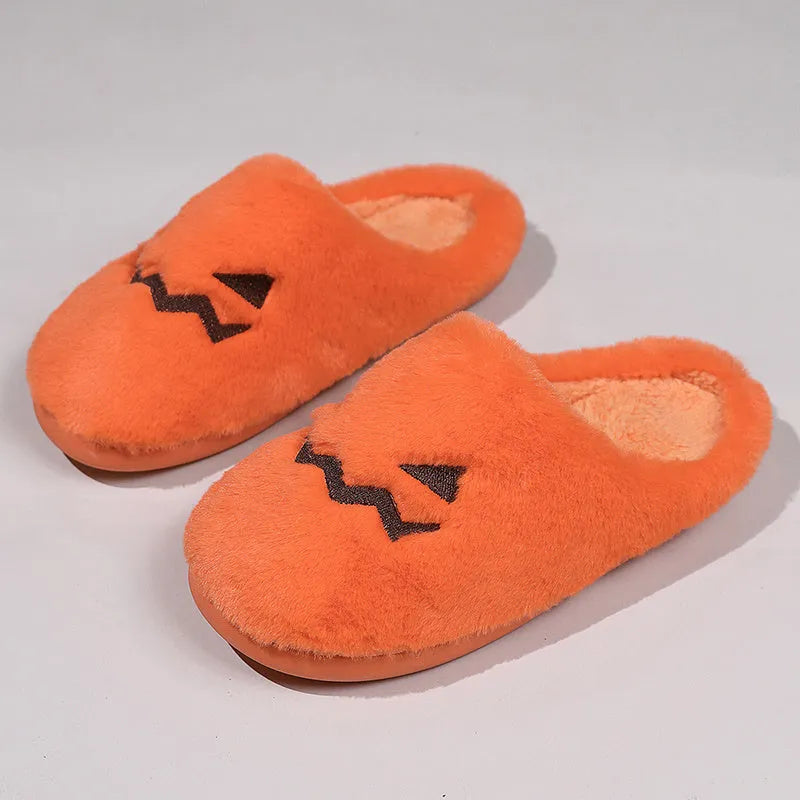 Orange Halloween pumpkin slippers with plush interior and non-slip PVC sole