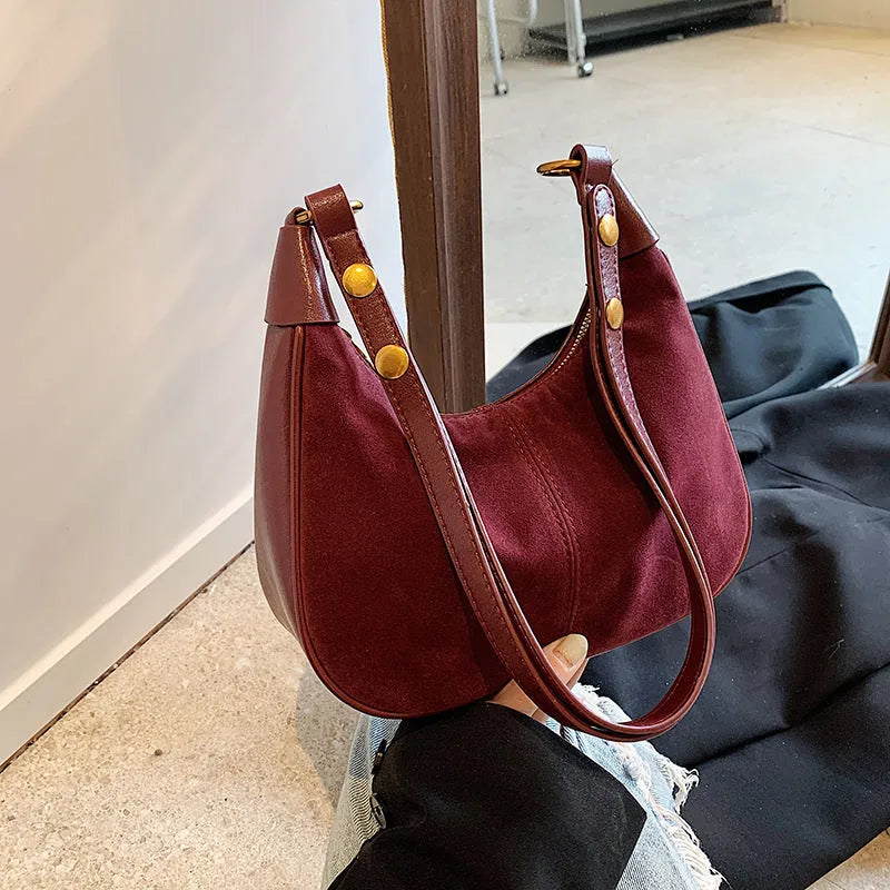 Retro commuter crossbody bag in black PU with oval shape and three-dimensional pocket
