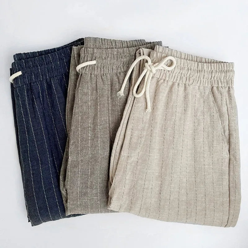Men's thin cotton linen casual trousers in a cropped length, shown in a striped pattern.