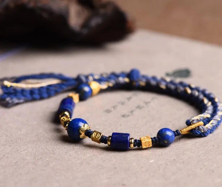Close-up of a hand-woven flexible wire watch band in Lapis Lazuli blue colour.