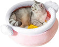 Pink honey pot-shaped cat sofa bed with a magic wand, showing a removable cushion inside.