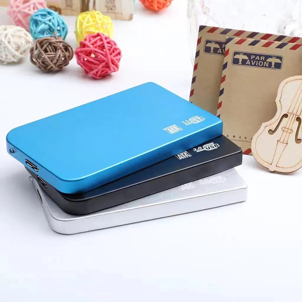 Silver metal USB 3.0 solid state external hard drive with data cable.