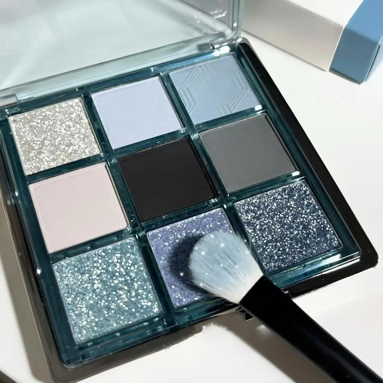 MUGELEEN nine-colour eye shadow palette with blue smoked colours and earth tones