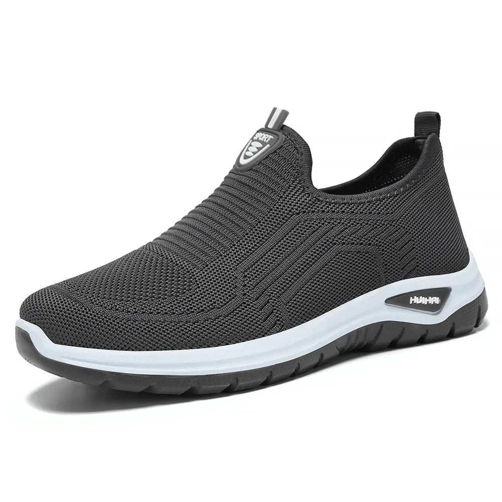 Men's grey breathable casual slip-on shoes with mesh detailing and a round toe.