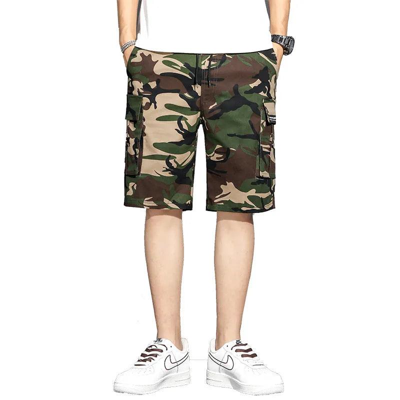 Men's camouflage 5-point workwear shorts in green, front view, with drawstring waist and mid-thigh length