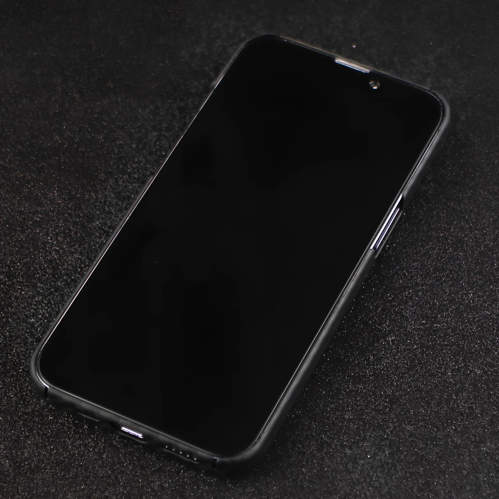 Matte black Kevlar fibre iPhone 12 case with crater texture and exposed buttons for drop protection