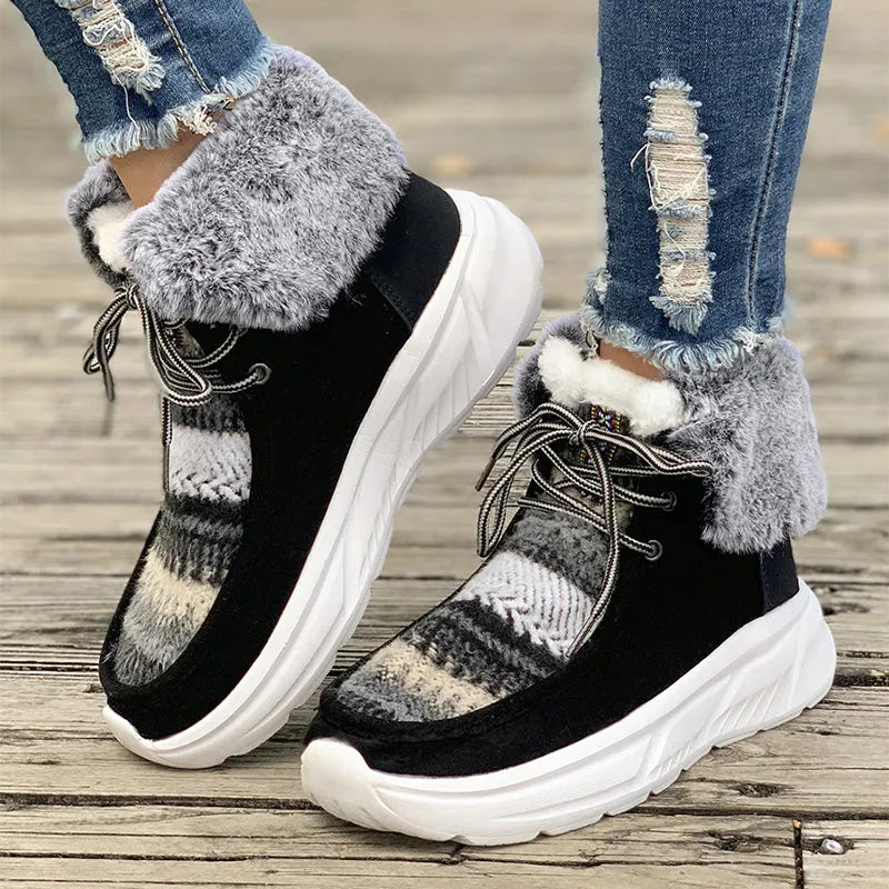 Beige women's lace-up suede snow boots with fuzzy lining and a thick soft sole platform.