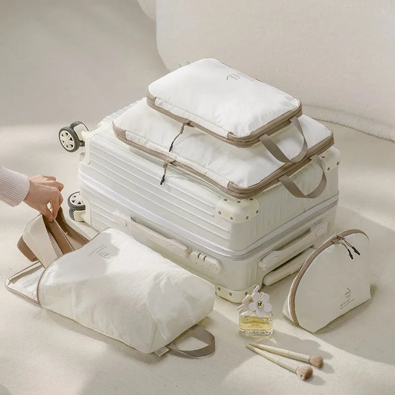 Taslon travel storage bag set with compression big bag, medium bag, shoe bag, and underwear bag for luggage organisation.