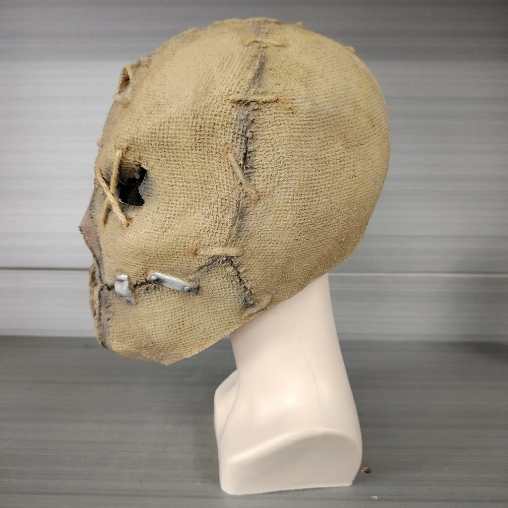 Latex Halloween horror mask with scar skull design showing dimensions of 31cm height