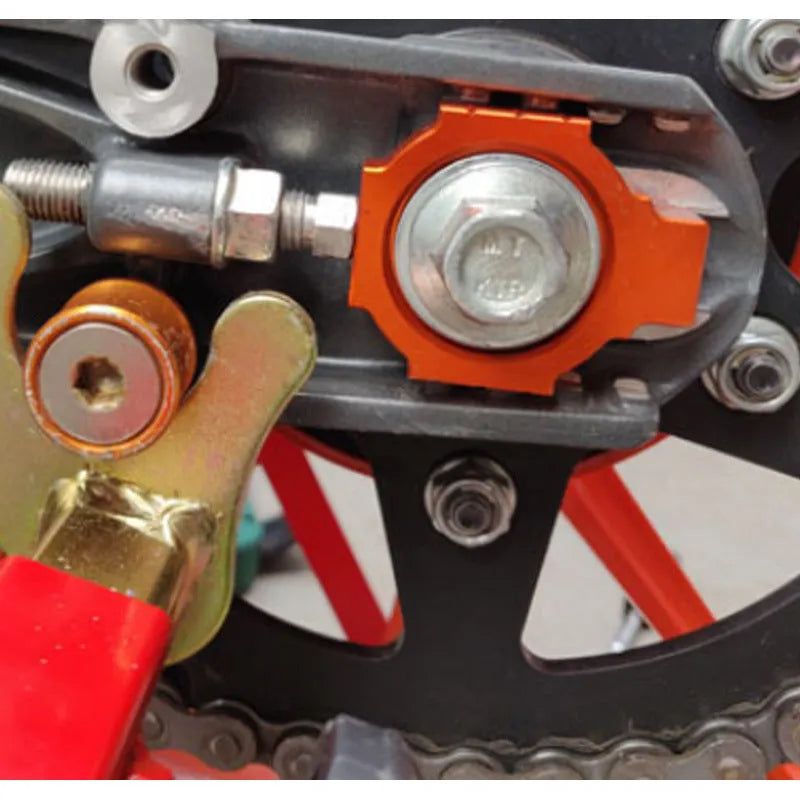 Orange KTM motorcycle rear fork regulator screw kit for Duke 200, 390, 990 models