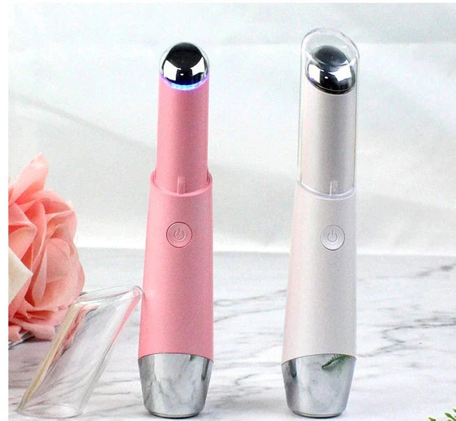 Portable eye massager with vibration and heat therapy to reduce wrinkles, dark circles, and puffiness around the eyes