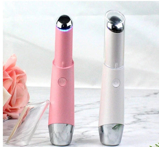 Portable eye massager with vibration and heat therapy to reduce wrinkles, dark circles, and puffiness around the eyes