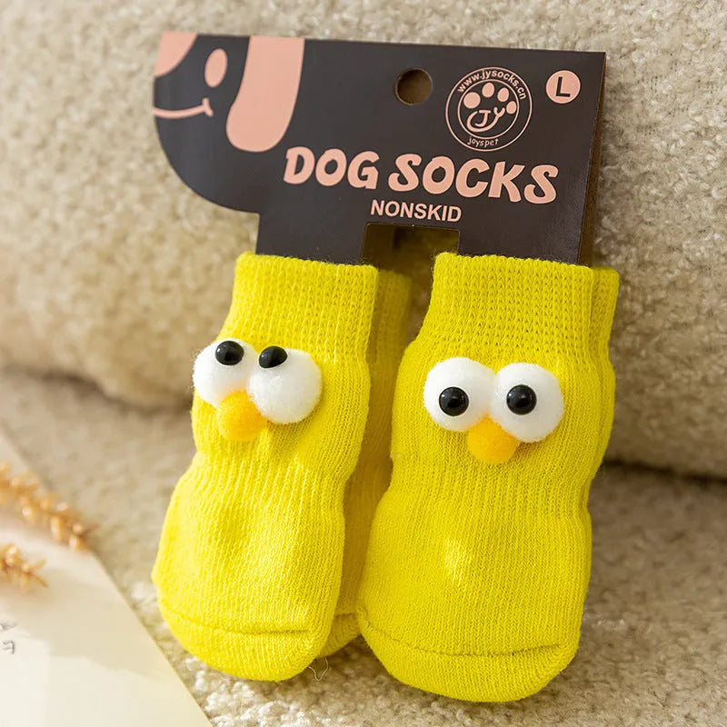 Dog all-season universal cotton socks with cute big eyes, anti-slip sole, green colour, side view on wooden floor