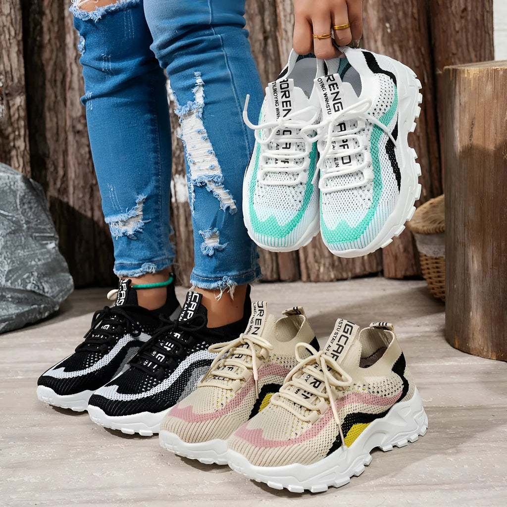 Women's black and white mesh casual sports shoes with a PVC sole and lace-up front.