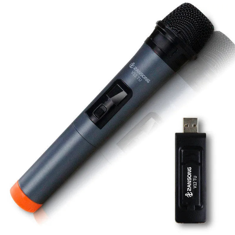 Black dynamic microphone with metal grill, USB receiver, adapter, and audio cable on dark background