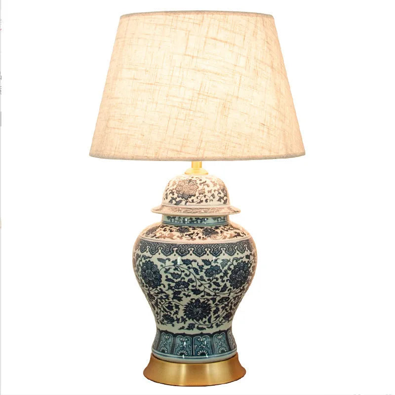 Blue and white Chinese porcelain table lamp with handmade cloth shade on copper base