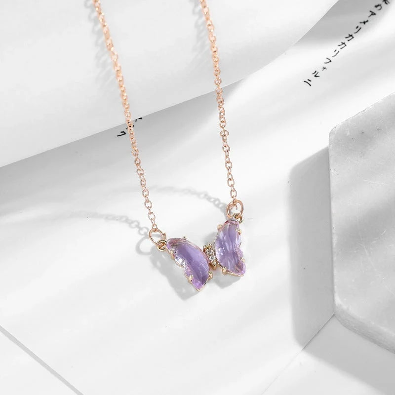 Glass Crystal Butterfly Necklace with adjustable water wave chain in blue, purple, light blue, and pink