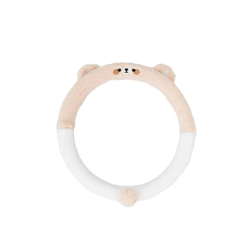 Plush rabbit fur steering wheel cover with embroidered panda design, shown fitted on a car wheel.