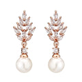 Geometric flower earrings with micro inlaid zircon stones and pearl elements in three plating colours