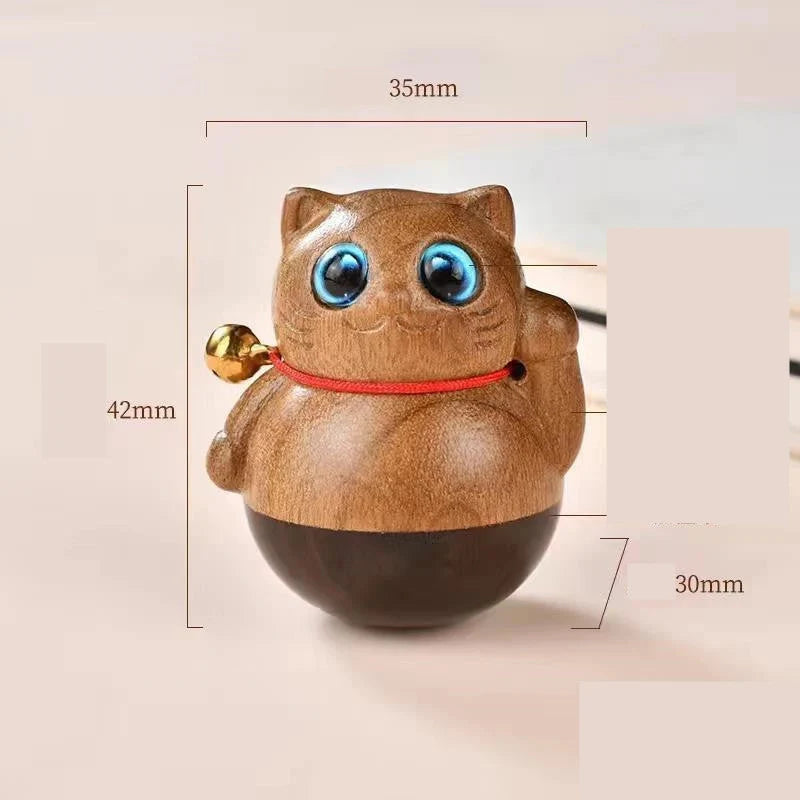 Handcrafted sandalwood kitten ornaments in various styles and colours