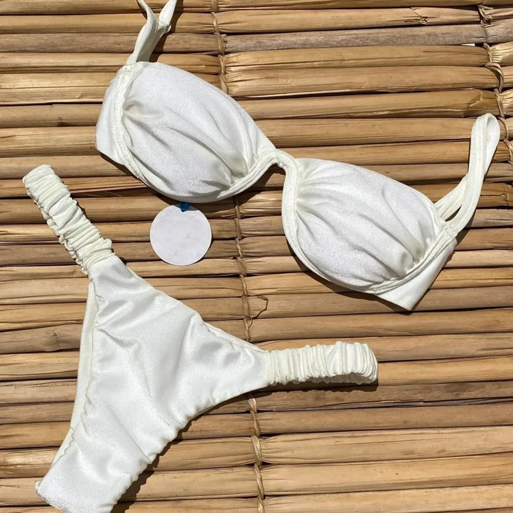 Women's black underwire bikini top and briefs set made from high elasticity nylon fabric.