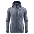 Man wearing a lightweight grey hooded nylon jacket for summer sun protection