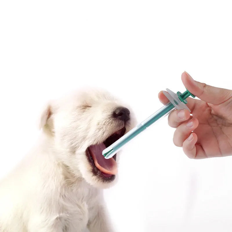 Two pet pill shooters with soft silicone tips in different sizes for administering tablets to cats and dogs