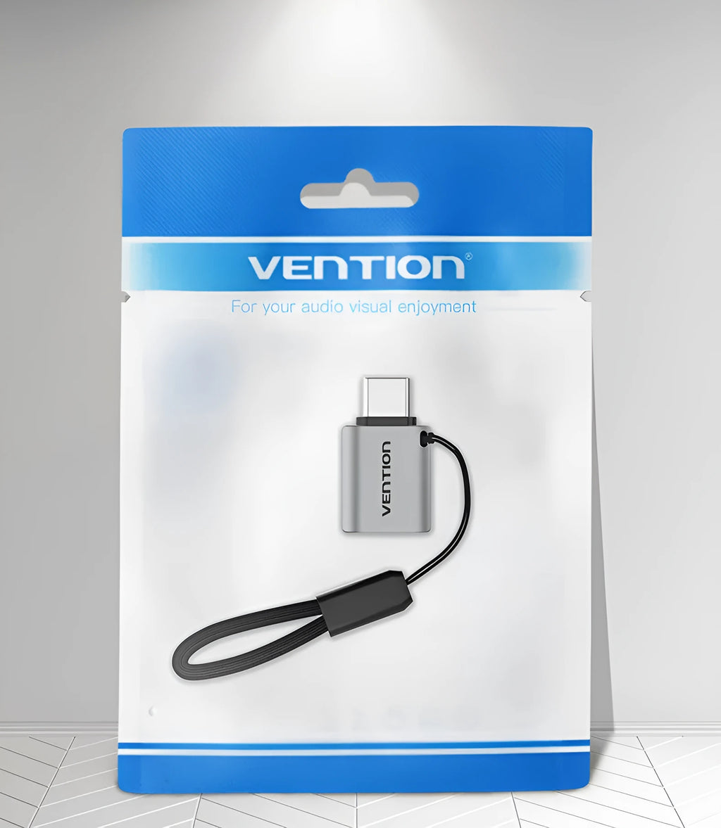 Grey aluminium alloy USB-C male to USB-A female OTG adapter with a black lanyard attached.