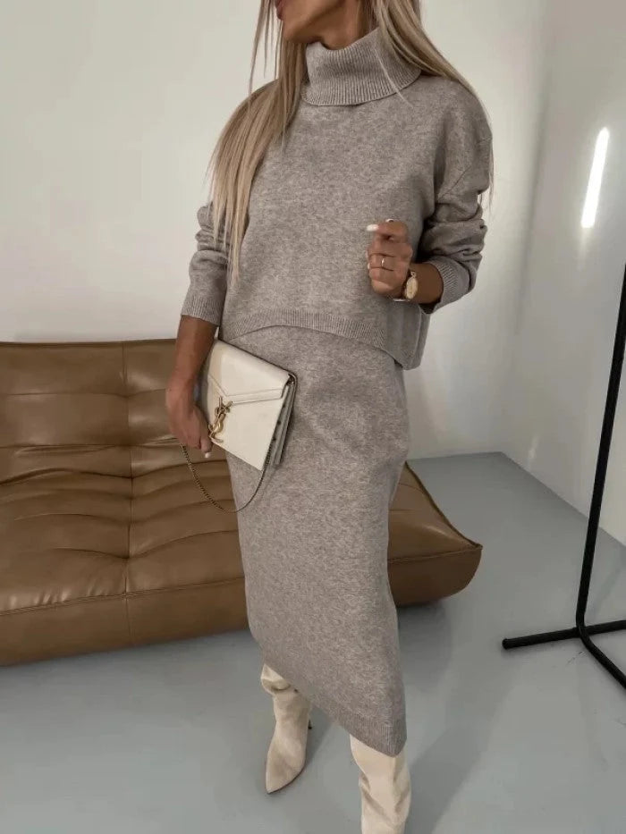 Women's winter fashion two-piece set featuring a turtleneck pullover and sleeveless long dress in white, grey, or camel.