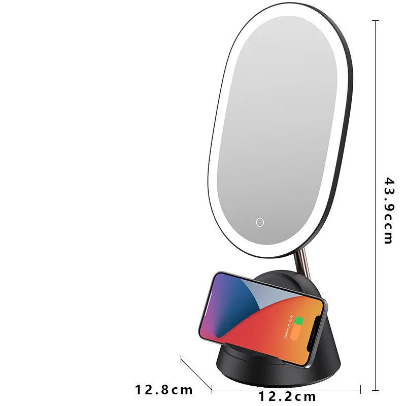 White and black desktop makeup mirror lamp on a table, showing mirror and light.