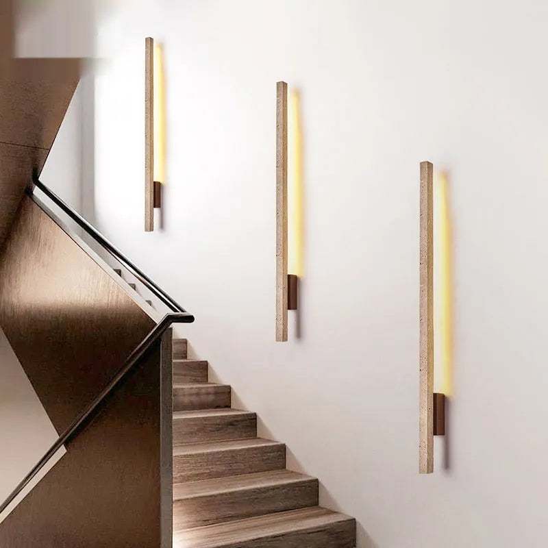 Minimalist strip wall lamp with warm light, cave stone base, black wood colour finish, 55cm length
