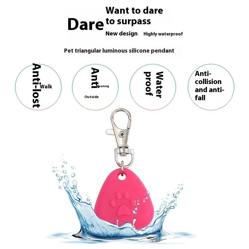 A glowing triangular silicone pendant ornament for pets, shown in various colours on card packaging.