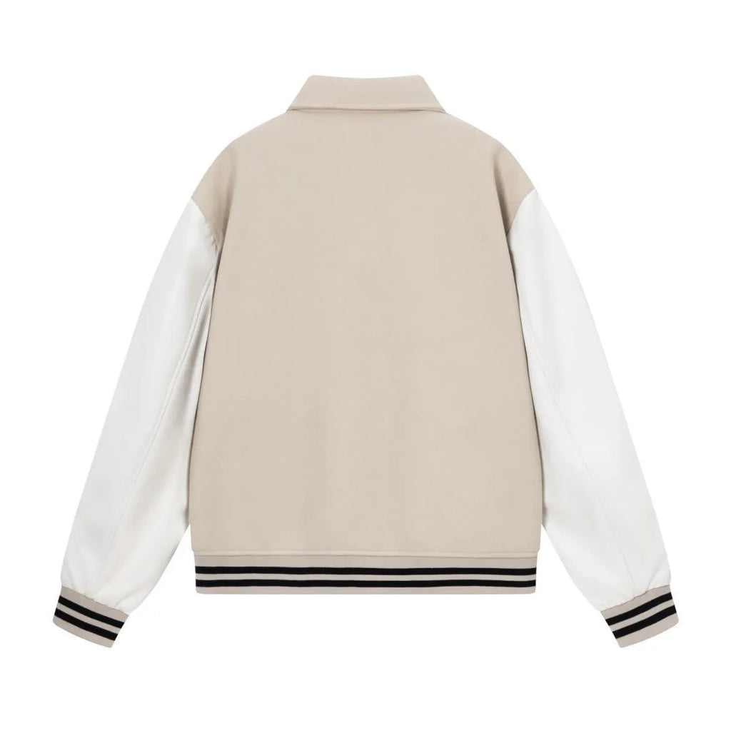 Women's apricot jacket with bone embroidery detail on the front, shown on a hanger.