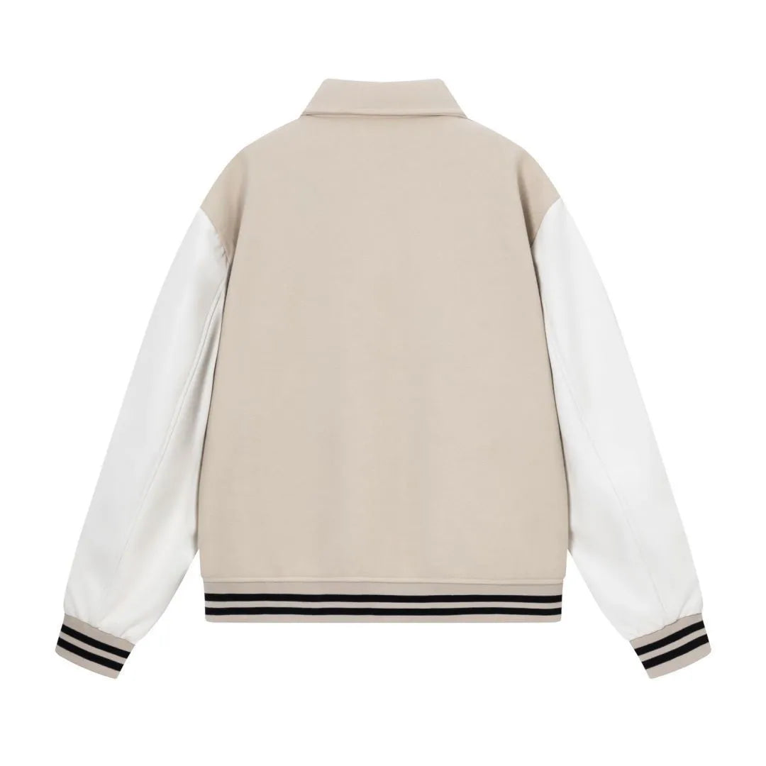 Women's apricot jacket with bone embroidery detail on the front, shown on a hanger.