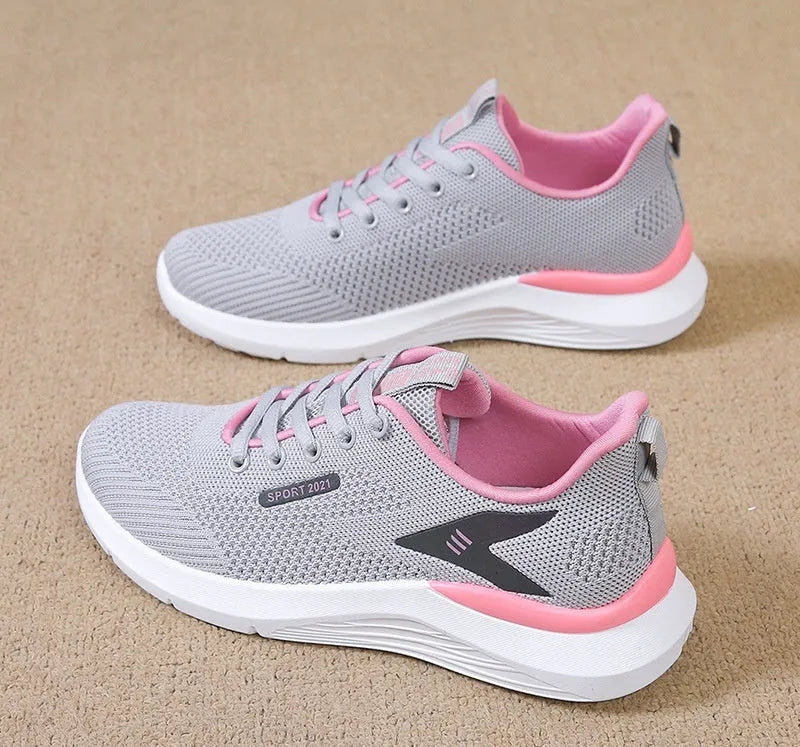Low-top women's casual running shoes in beige with mesh upper, round toe, and front lace-up closure