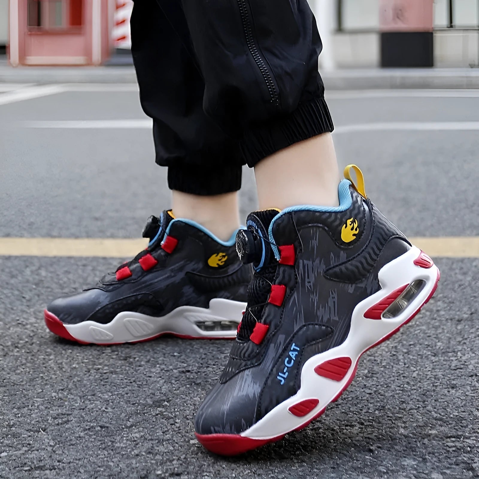 Boys rotating button basketball running shoes in black, available in youth and children's sizes.