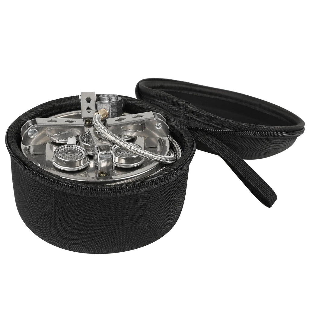 Silver portable split stove for outdoor camping and picnics on a flat surface.